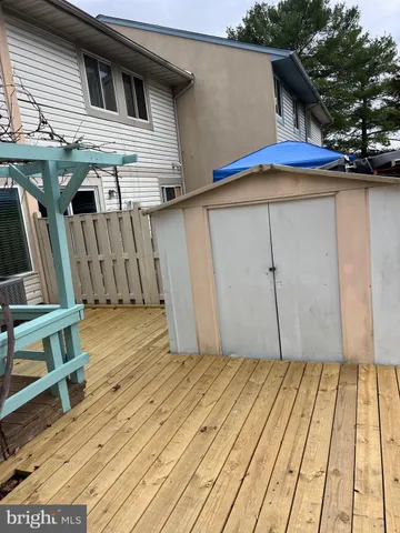 a view of a house with sitting area and wooden floor