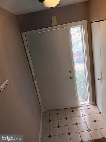 a view of an empty room with windows