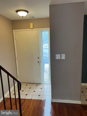 a view of entryway with wooden floor