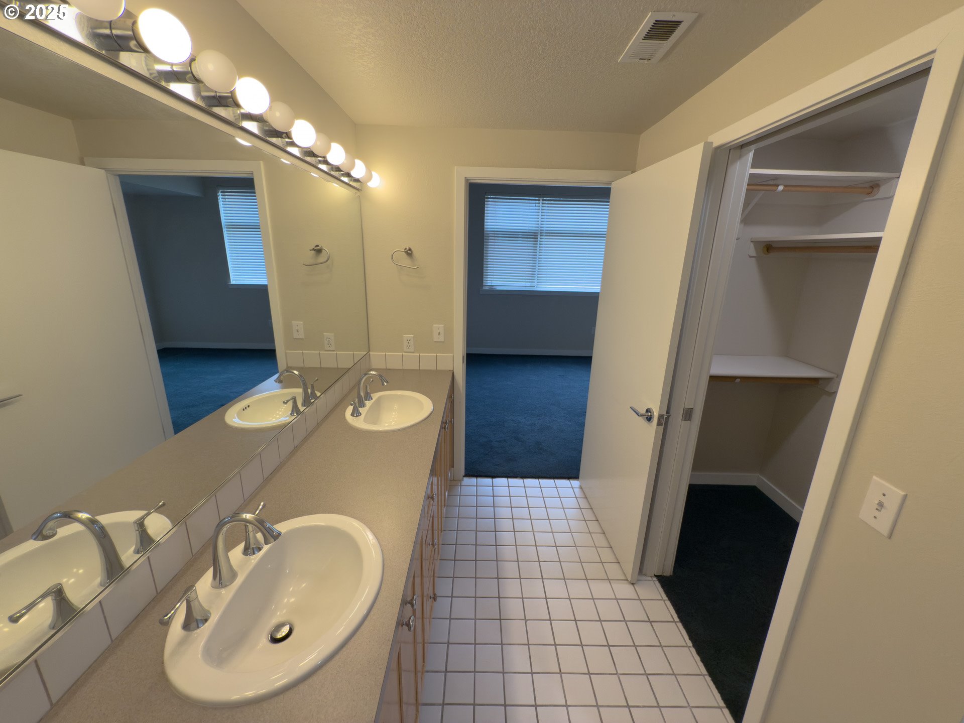 2327 Northwest Northrup Street, Unit 8 Portland, OR 97210 - Photo 12 of 33 a bathroom with a sink a vanity and a mirror