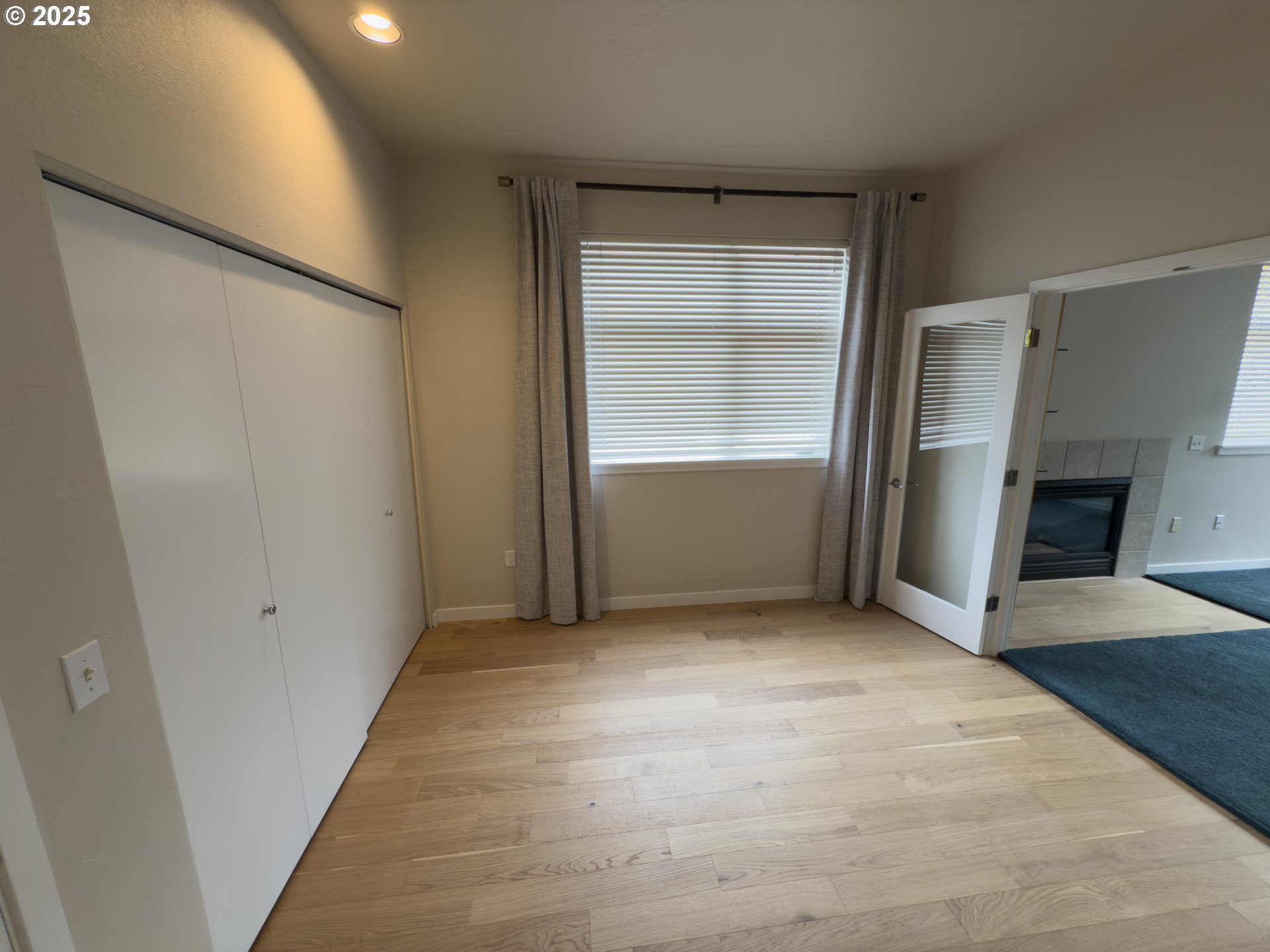 2327 Northwest Northrup Street, Unit 8 Portland, OR 97210 - Photo 19 of 33 an empty room with closet and windows