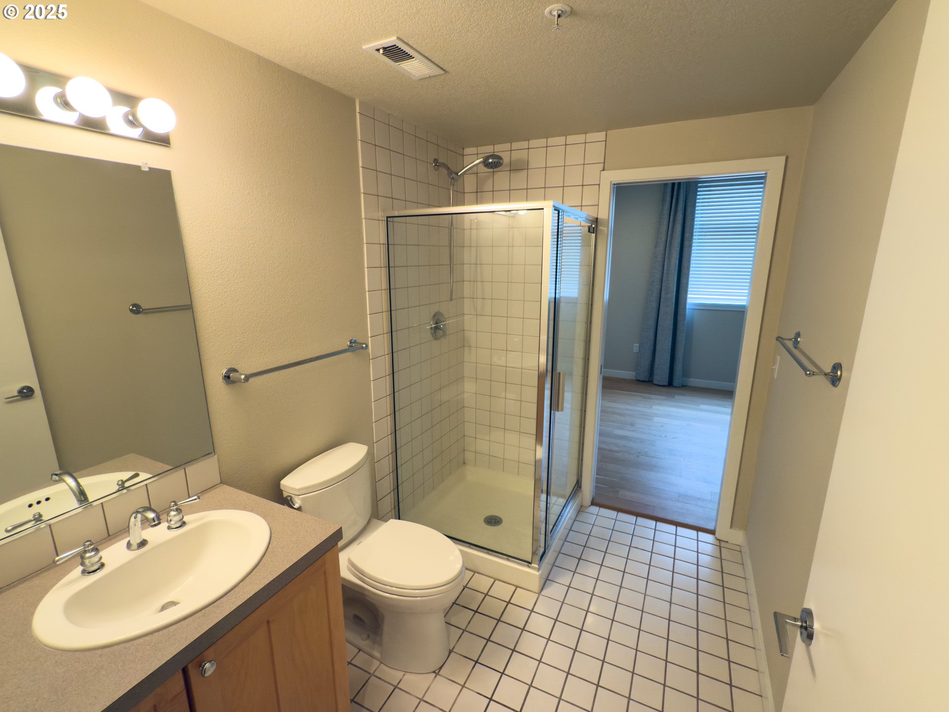 2327 Northwest Northrup Street, Unit 8 Portland, OR 97210 - Photo 21 of 33 a bathroom with a sink a toilet and shower
