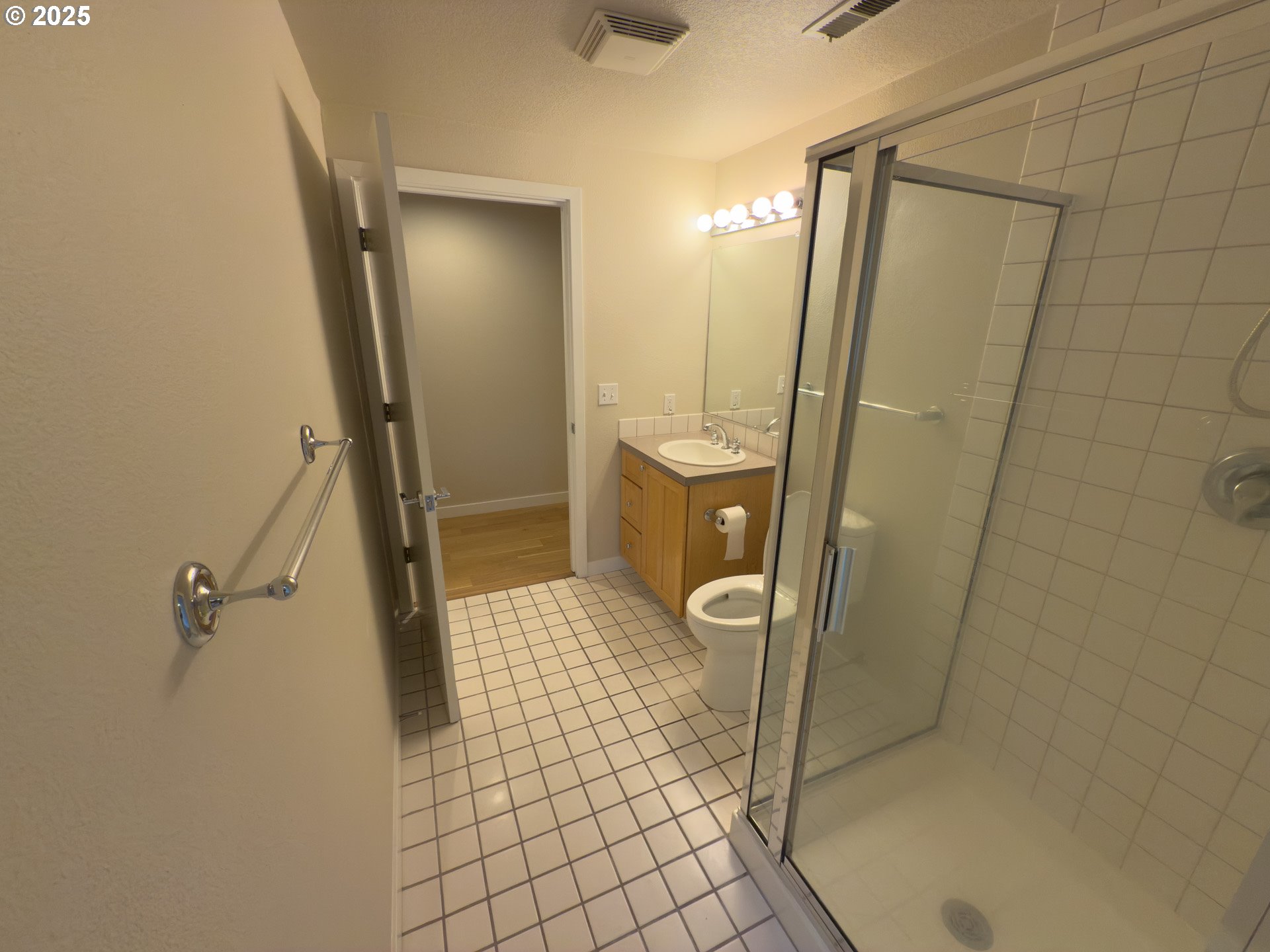 2327 Northwest Northrup Street, Unit 8 Portland, OR 97210 - Photo 22 of 33 a bathroom with a granite countertop shower and a mirror
