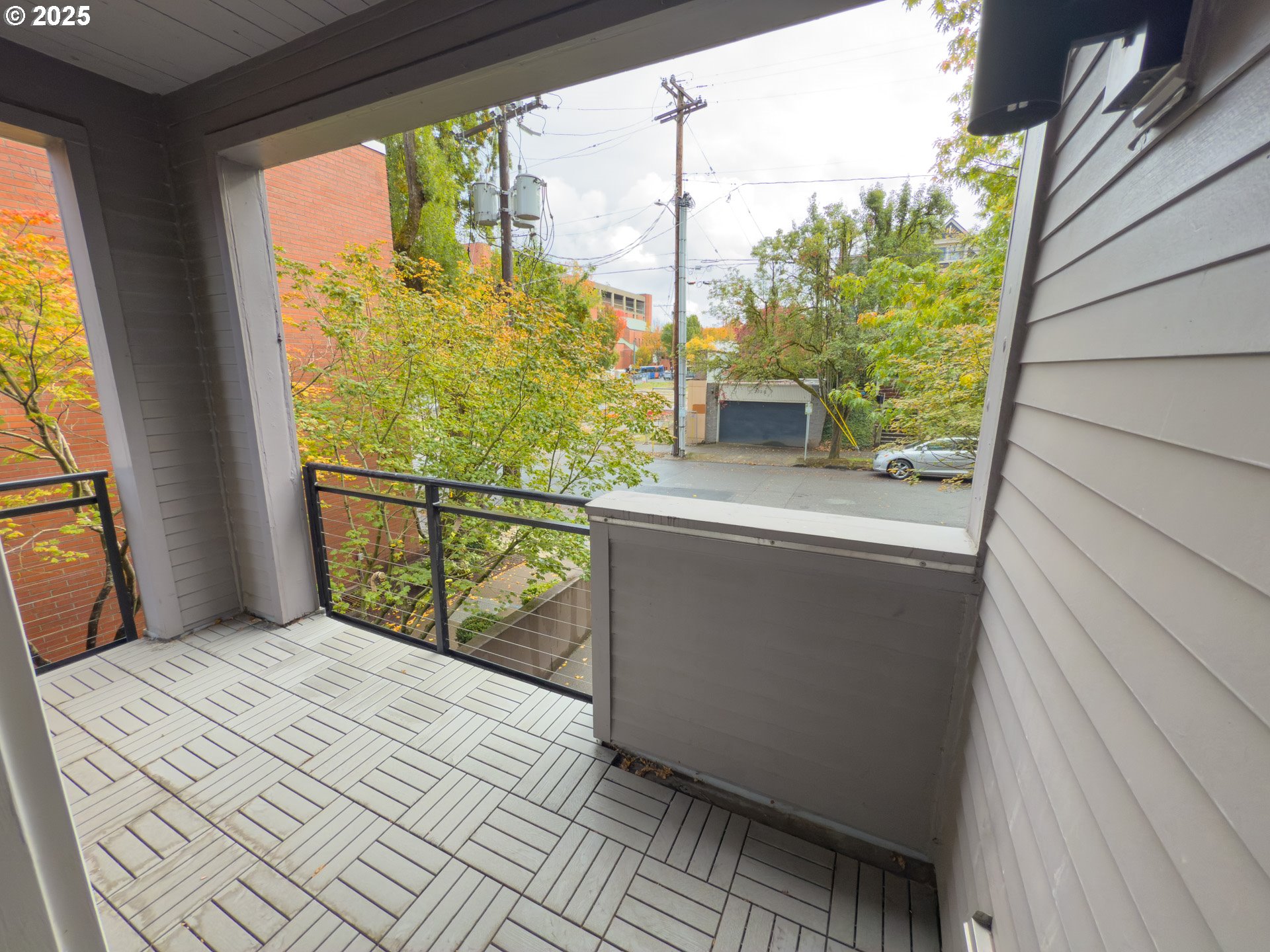 2327 Northwest Northrup Street, Unit 8 Portland, OR 97210 - Photo 24 of 33 a bedroom with a bed and a window
