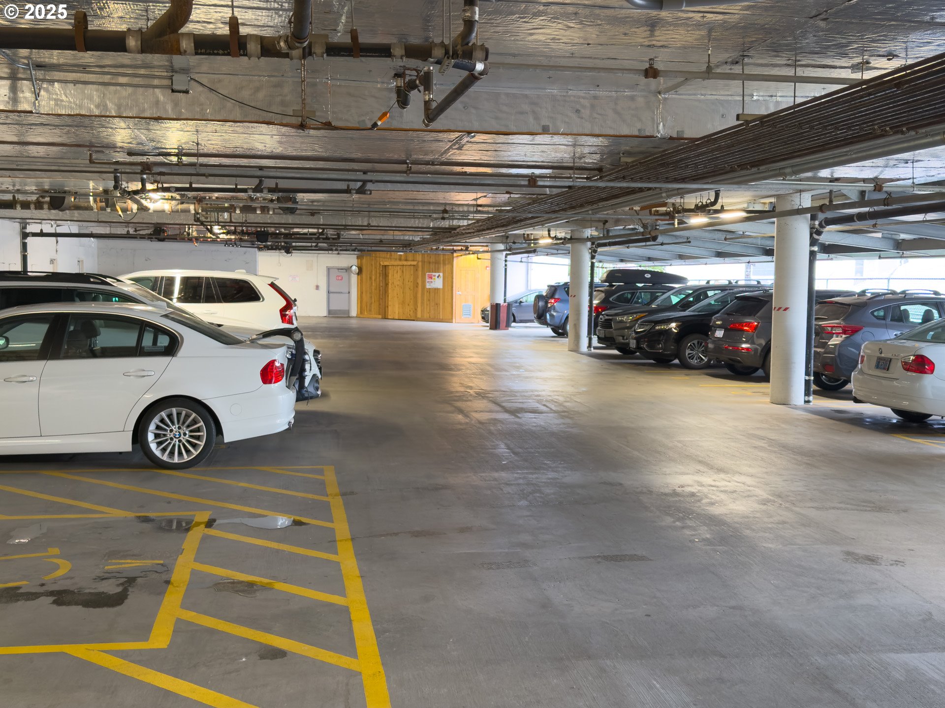 2327 Northwest Northrup Street, Unit 8 Portland, OR 97210 - Photo 28 of 33 a view of parking garage with cars parked