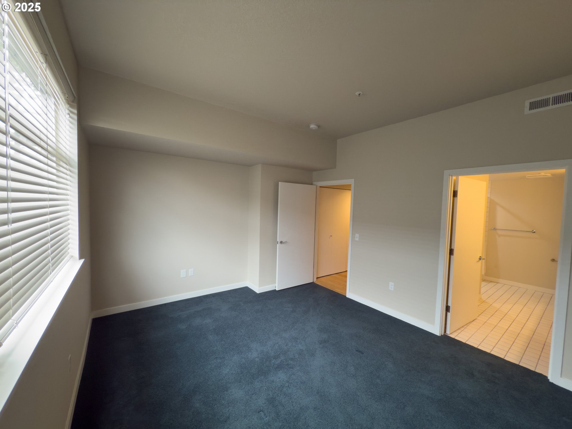 2327 Northwest Northrup Street, Unit 8 Portland, OR 97210 - Photo 10 of 33 an empty room with a window