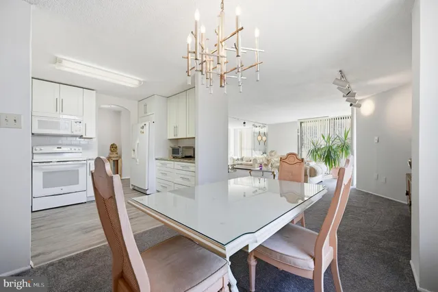 a view of a big room with a big yard and large trees