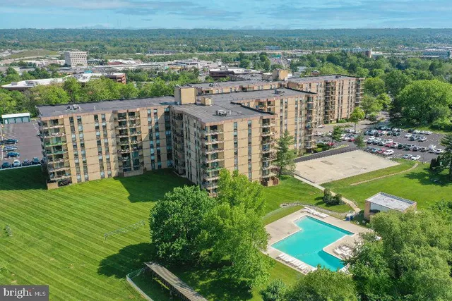 a view of street with parked cars