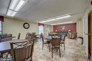 a view of a room with lots of white furniture