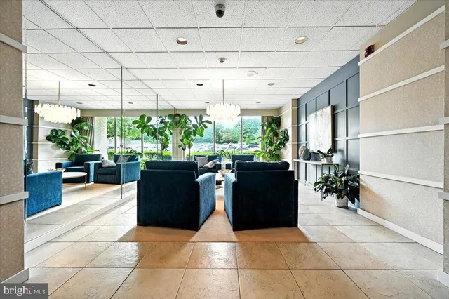 a bedroom with a bed and a chair