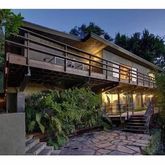 a view of a house with a small park