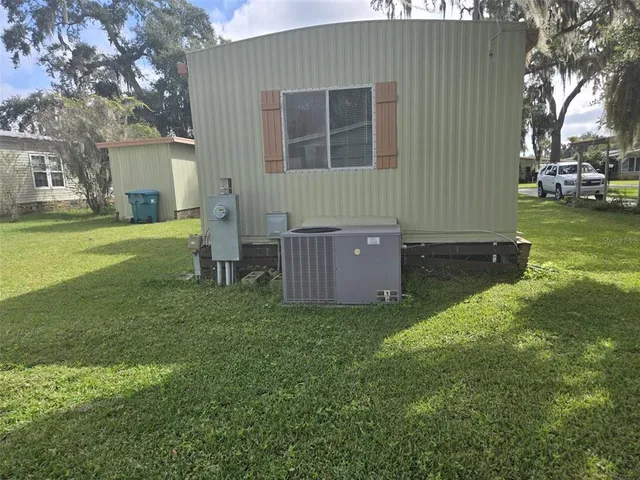 a backyard of a house with lots of green space
