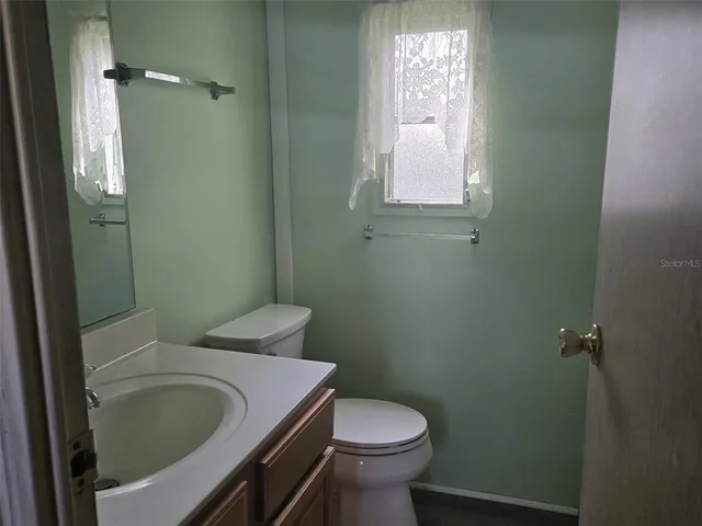 a bathroom with a sink and toilet