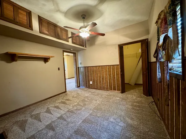 a view of a hallway with a chandelier
