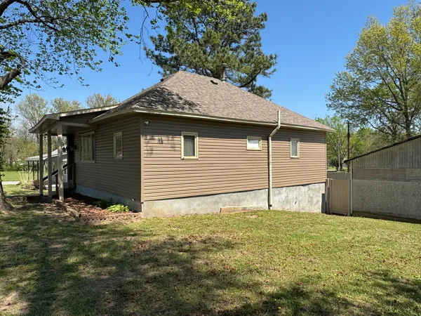 a house with a tree in the background