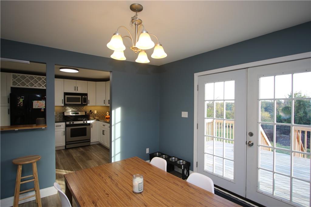 290 Lincoln Hall Road Elizabeth, PA 15037 - Photo 8 of 24 Glass French Doors Open to the Deck & Call in the Natural Light! Breakfast Bar Opens to the Kitchen for Extra Entertaining Space.
