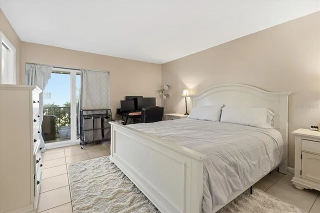 a bedroom with a bed and a couch