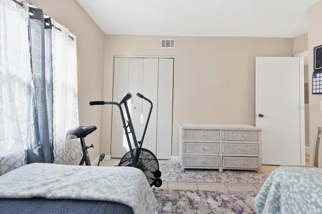 a bedroom with a bed and a dresser