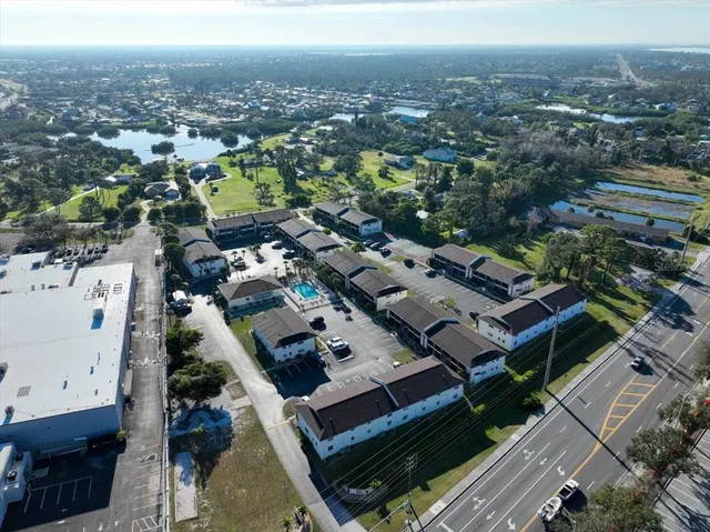 an aerial view of a house with a city view