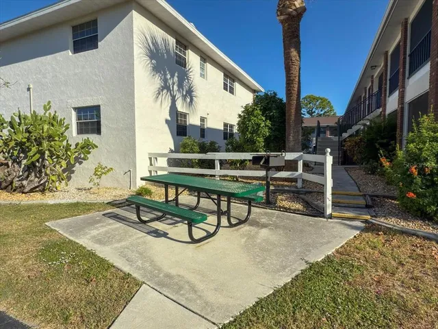 a view of chairs and tables in patio