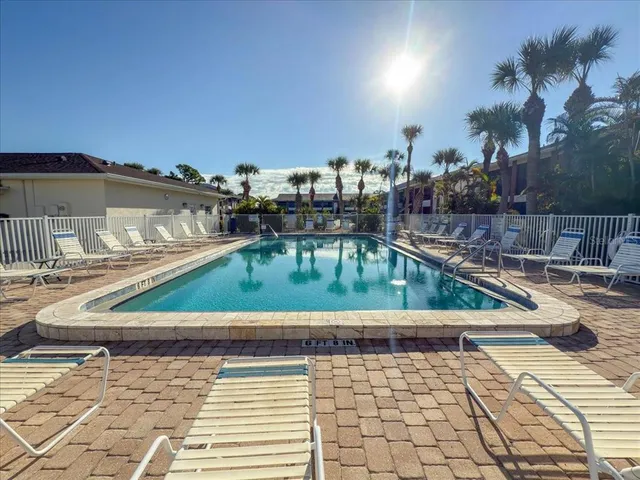 a view of swimming pool with a patio