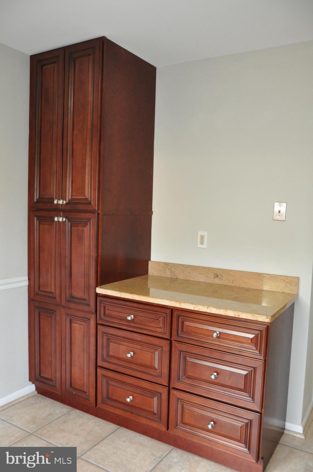 9705 Glen Avenue Silver Spring, MD 20910 - Photo 11 of 47 a view of wooden cabinets
