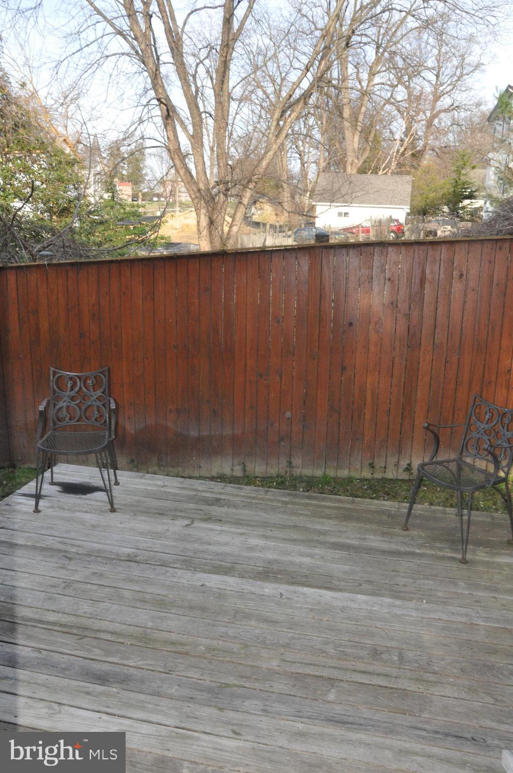9705 Glen Avenue Silver Spring, MD 20910 - Photo 14 of 47 a view of backyard with wooden fence and a large tree