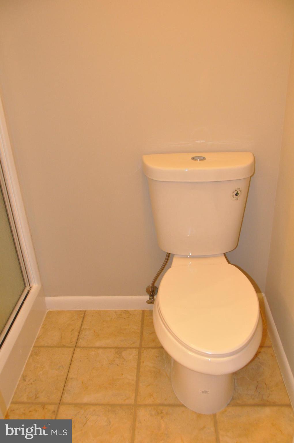 9705 Glen Avenue Silver Spring, MD 20910 - Photo 34 of 47 a bathroom with a toilet and a rug