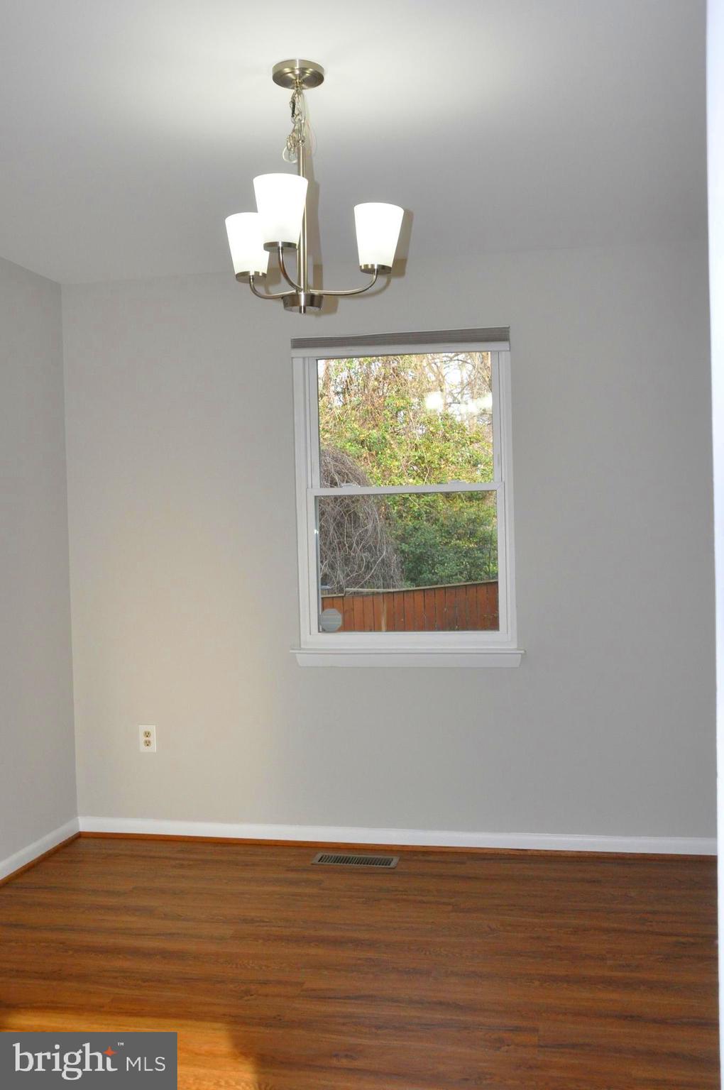 9705 Glen Avenue Silver Spring, MD 20910 - Photo 6 of 47 a view of wooden floor chandelier and window in a room