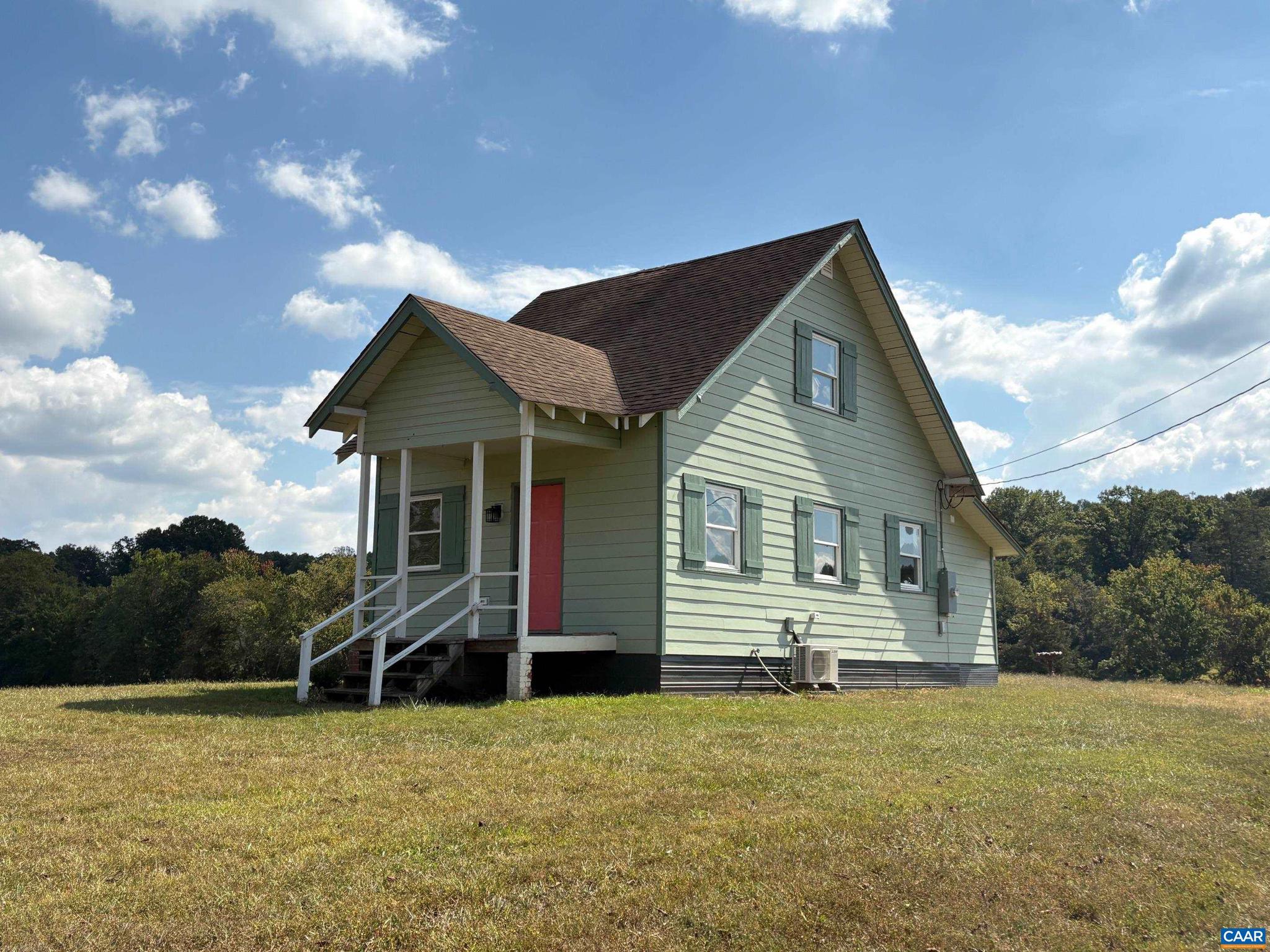 5912 & 5928 2 W Hoover Road Reva, VA 22735 - Photo 3 of 10 a front view of house with yard and trees in the background