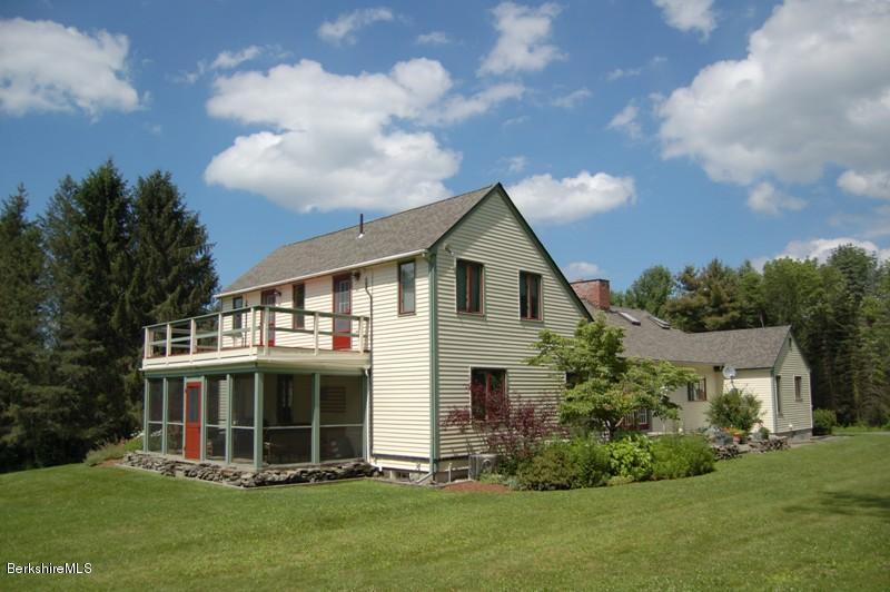 41 Baldwin Hill Road South Egremont, MA 01230 - Photo 14 of 17 a view of a white house with a yard potted plants and large tree