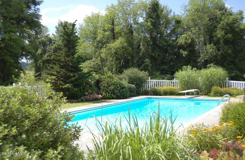 41 Baldwin Hill Road South Egremont, MA 01230 - Photo 4 of 17 a view of a swimming pool and trees in the background
