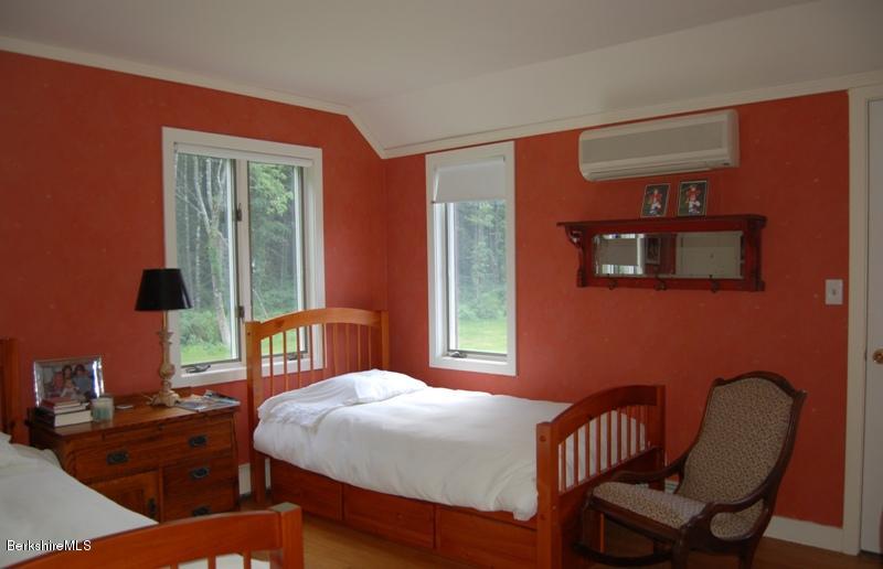 41 Baldwin Hill Road South Egremont, MA 01230 - Photo 10 of 17 a bedroom with a bed a table and chair