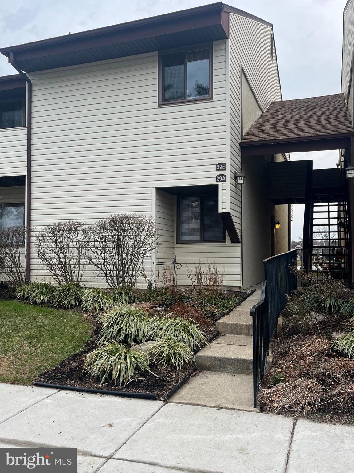 29 B East Daisy Lane Mount Laurel, NJ 08054 - Photo 12 of 14 a front view of a house with garden