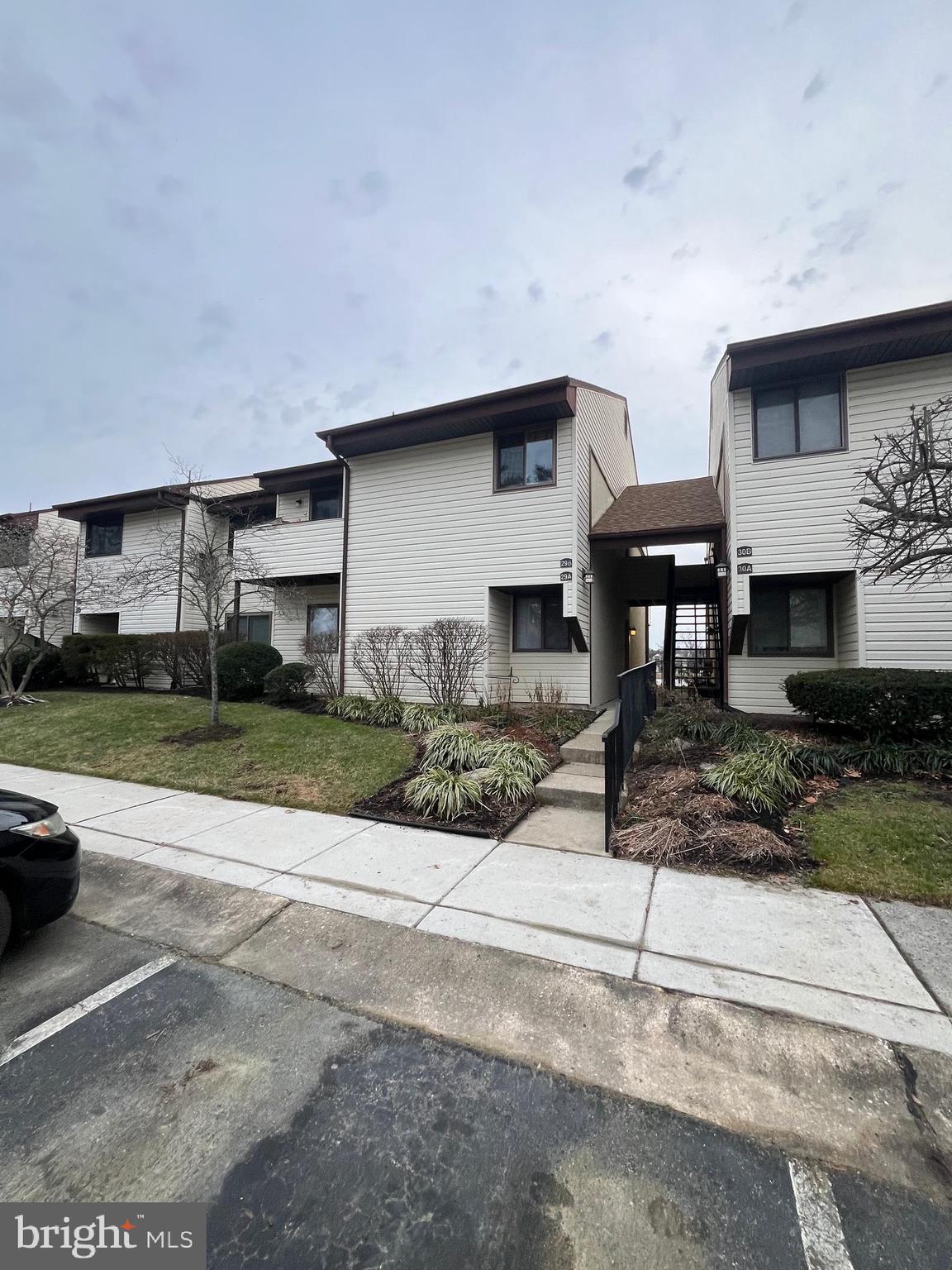 29 B East Daisy Lane Mount Laurel, NJ 08054 - Photo 14 of 14 a front view of a house with a yard and garage