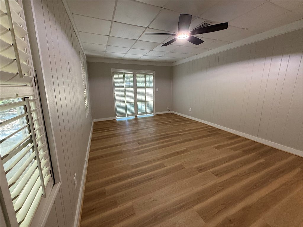 306 Crawford Road Opelika, AL 36804 - Photo 10 of 31 This bright room features durable flooring and convenient outdoor access, ideal for various uses.