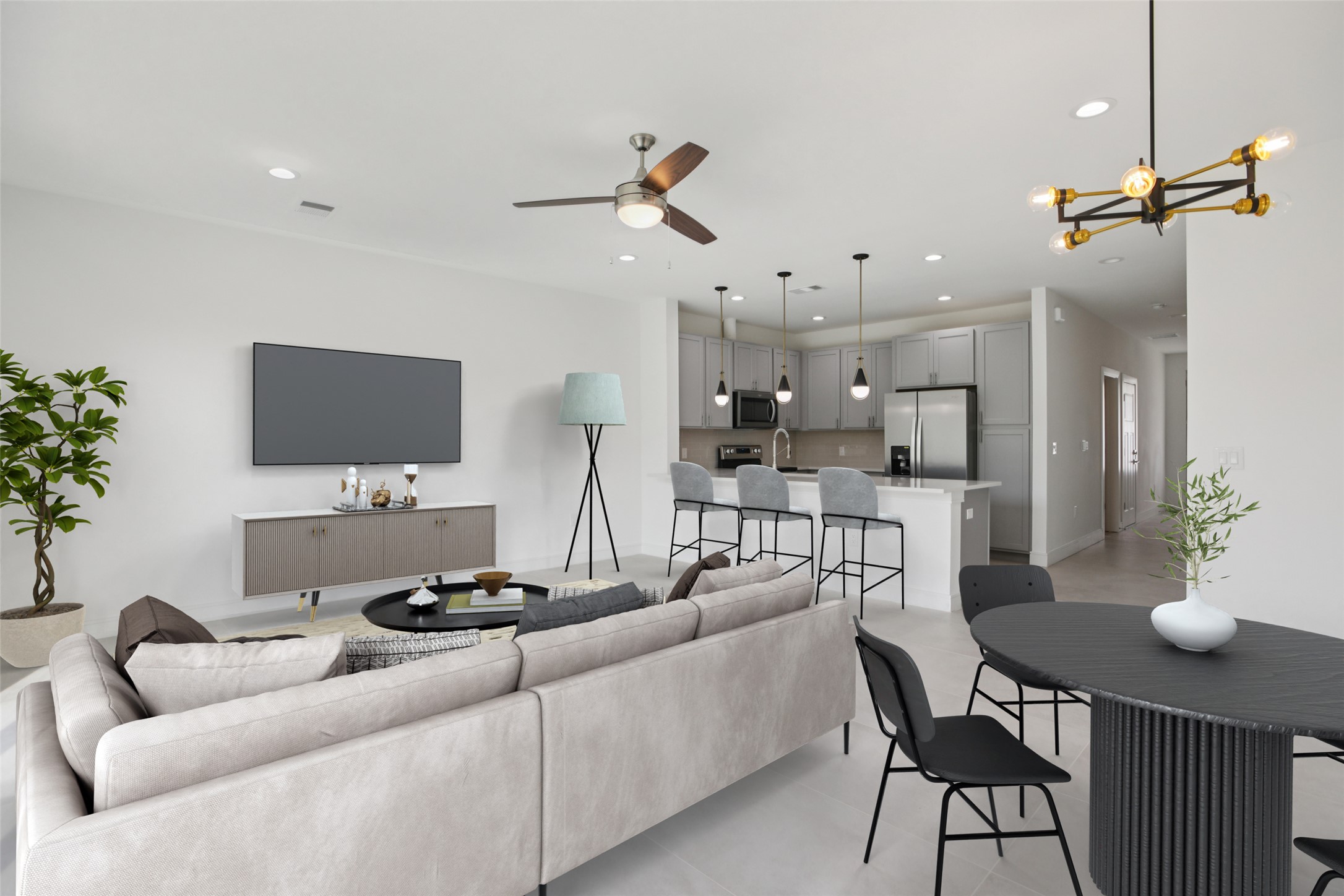 202 Tesla Circle Austin, TX 78681 - Photo 5 of 35 Living room with concrete floors, a ceiling fan, and a chandelier