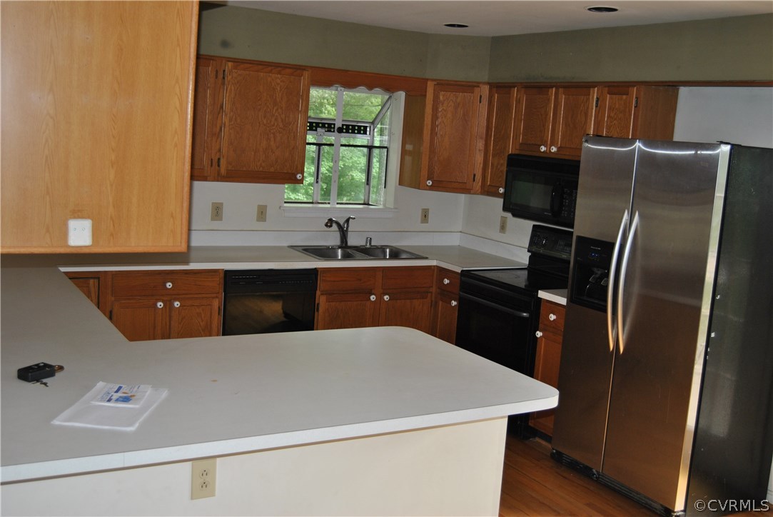 4482 Jericho Road Ruther Glen, VA 22546 - Photo 10 of 32 a kitchen with a sink a refrigerator and window