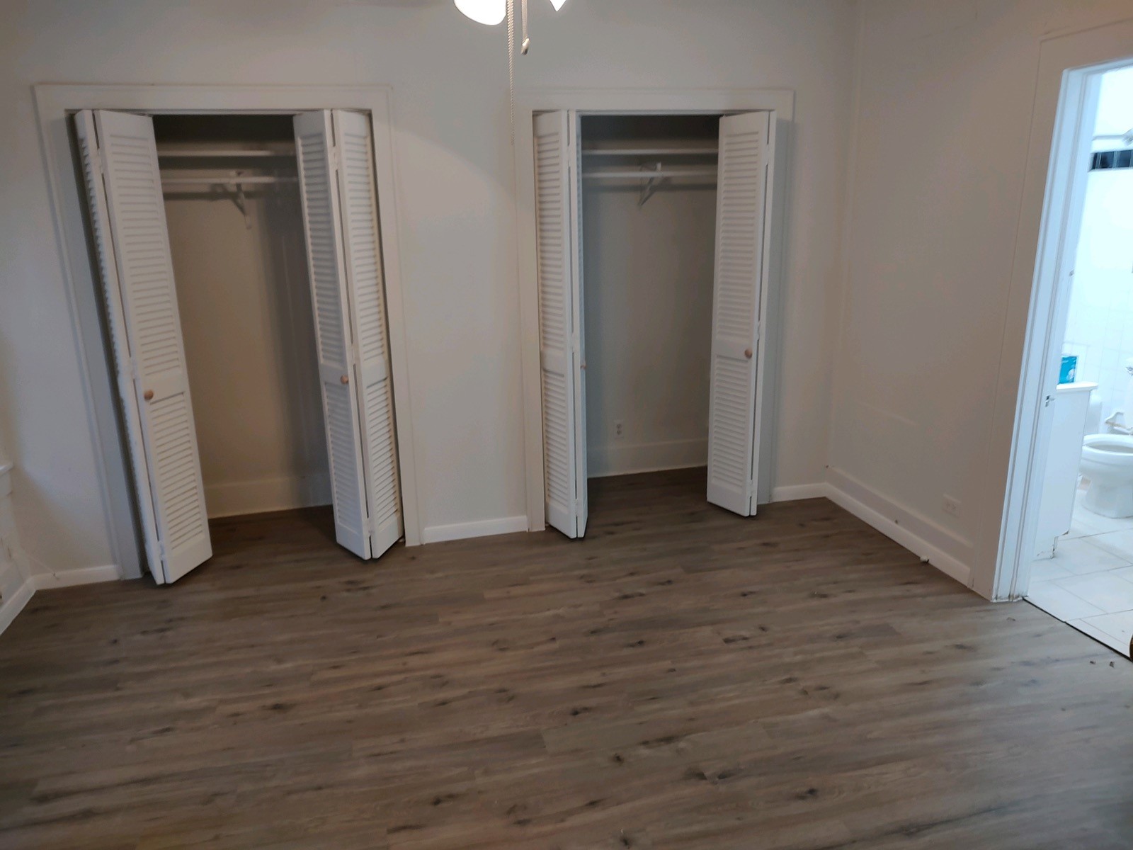 2634 Peckham Street Houston, TX 77098 - Photo 7 of 9 an empty room with wooden floor and closet