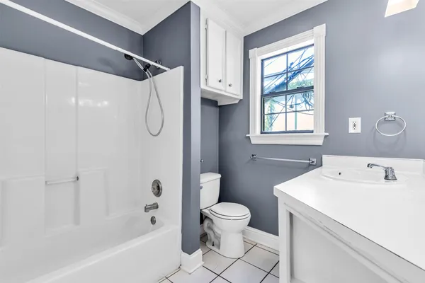a kitchen with a stove a sink and a refrigerator