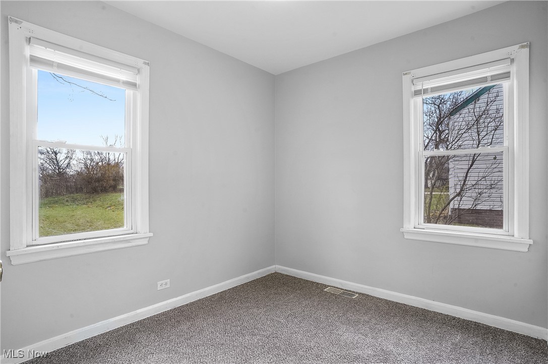 3206 9th Street Northwest Canton, OH 44708 - Photo 17 of 32 Unfurnished room with a healthy amount of sunlight and carpet floors