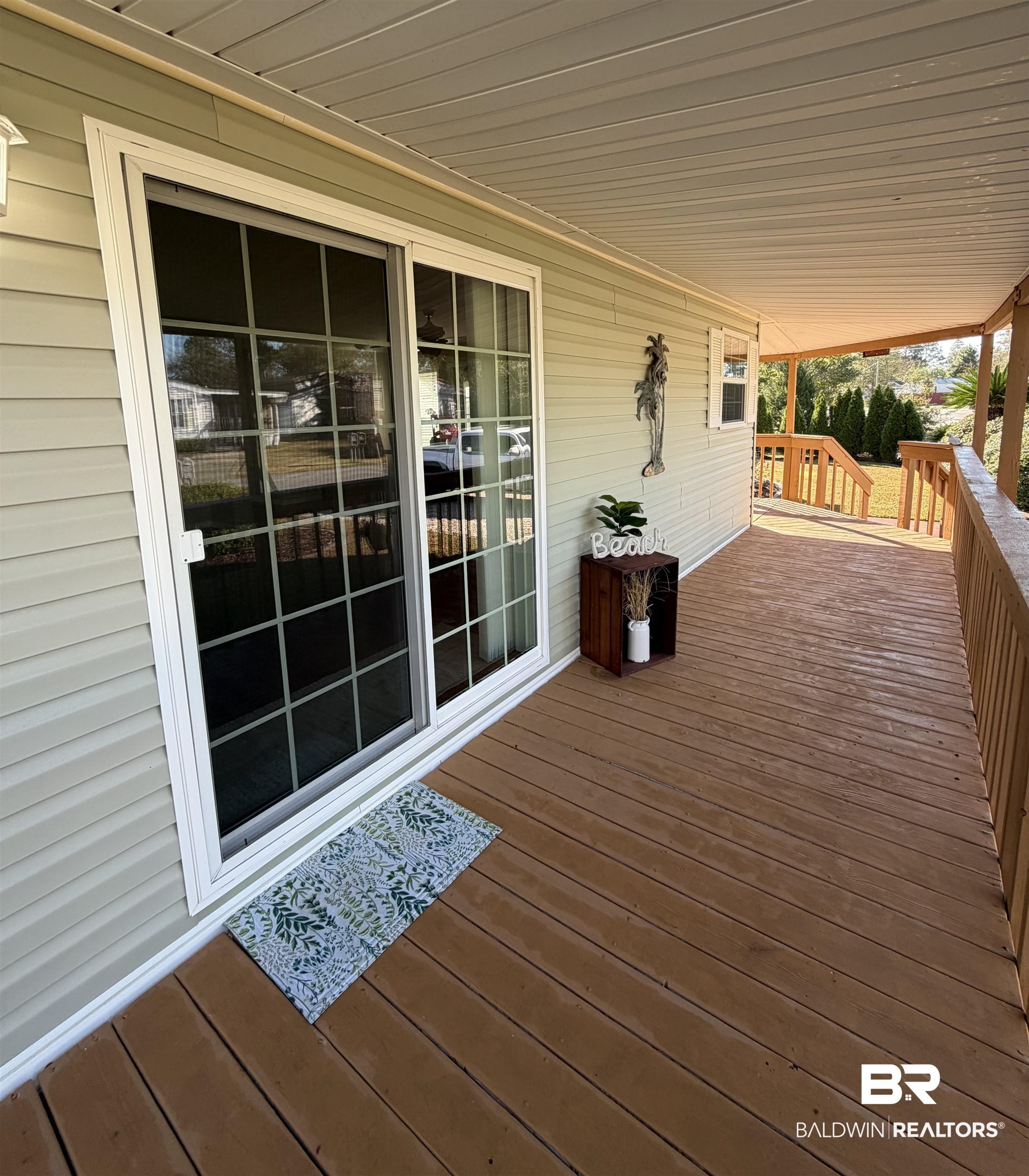 675 Escambia Loop Lillian, AL 36549 - Photo 10 of 44 View of wooden porch