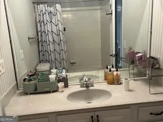 a bathroom with a sink and a mirror