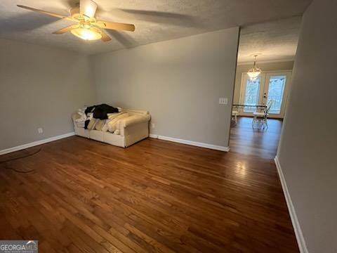 809 College Street Carrollton, GA 30117 - Photo 24 of 33 an empty room with wooden floor and ceiling fan