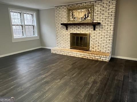 809 College Street Carrollton, GA 30117 - Photo 6 of 33 an empty room with wooden floor fireplace and windows