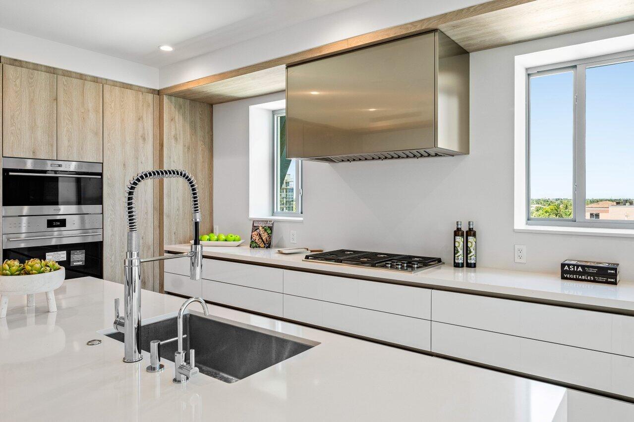 495 East Royal Palm Road, Unit 601 Boca Raton, FL 33432 - Photo 12 of 50 a kitchen with a sink cabinets and appliances