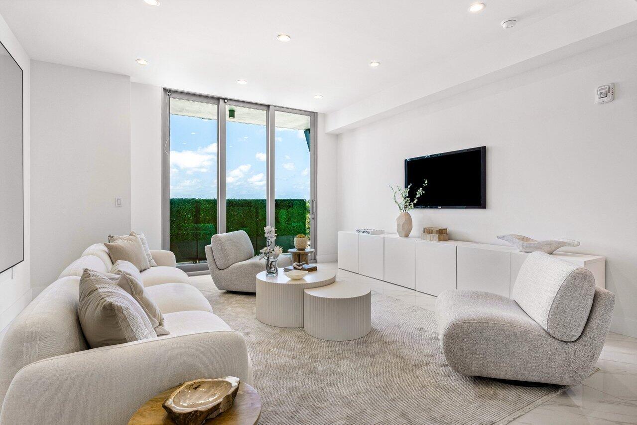 495 East Royal Palm Road, Unit 601 Boca Raton, FL 33432 - Photo 15 of 50 a living room with furniture and a flat screen tv