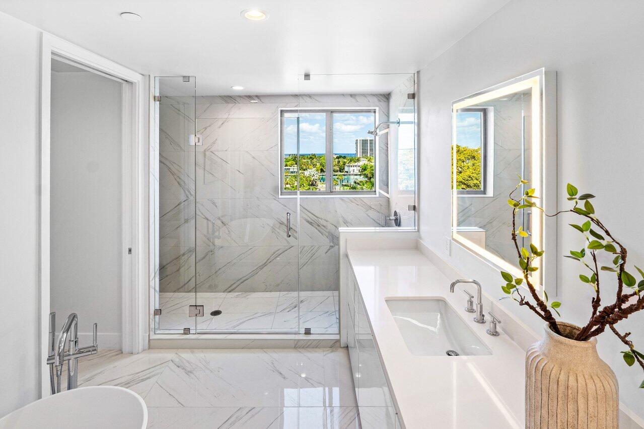 495 East Royal Palm Road, Unit 601 Boca Raton, FL 33432 - Photo 21 of 50 a bathroom with a tub sink and mirror