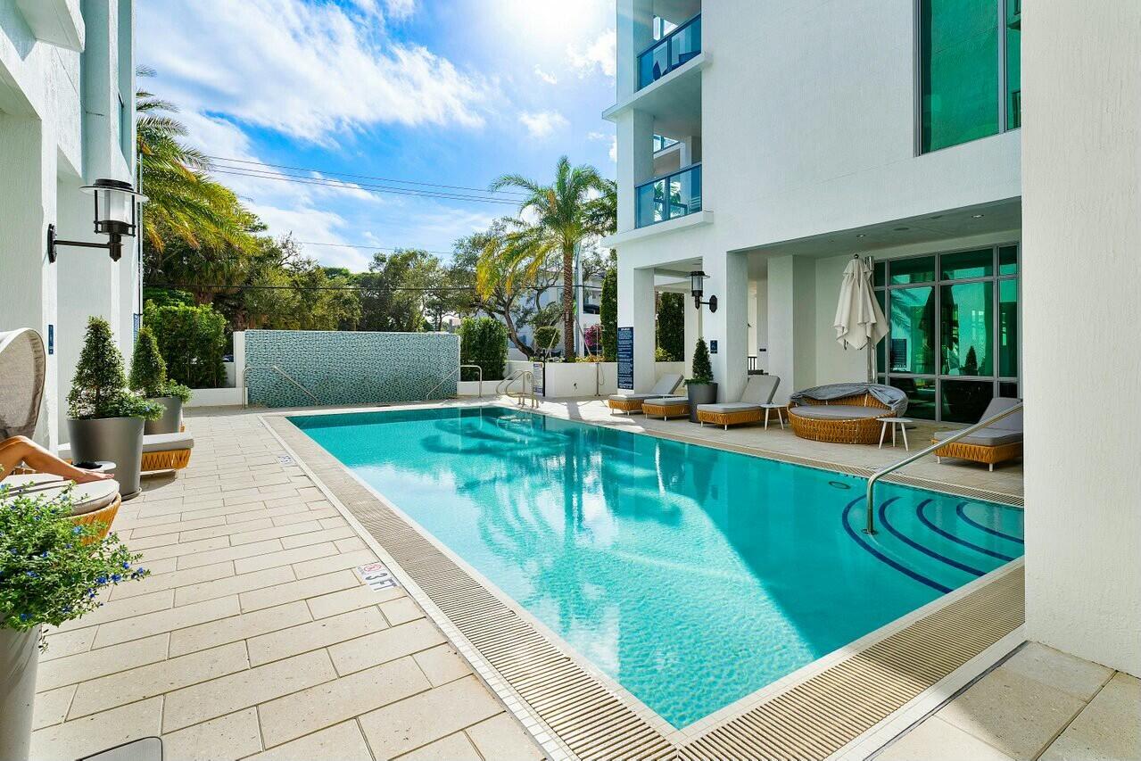 495 East Royal Palm Road, Unit 601 Boca Raton, FL 33432 - Photo 27 of 50 a view of a swimming pool with a patio