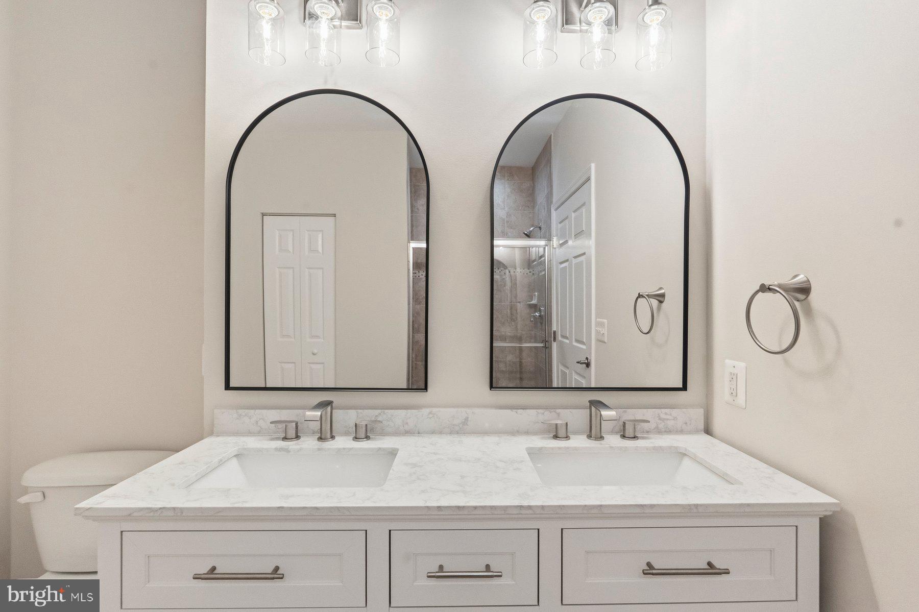 637 Wallingford Road, Unit 401 Bel Air, MD 21014 - Photo 19 of 28 Elegant dual mirrors in a chic bath.